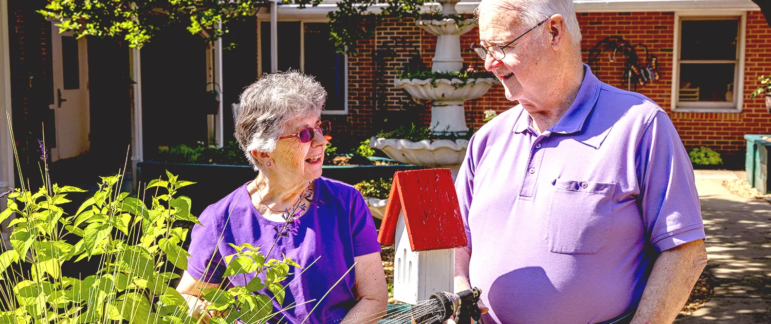 Neighbors sharing time together in a sunny courtyard