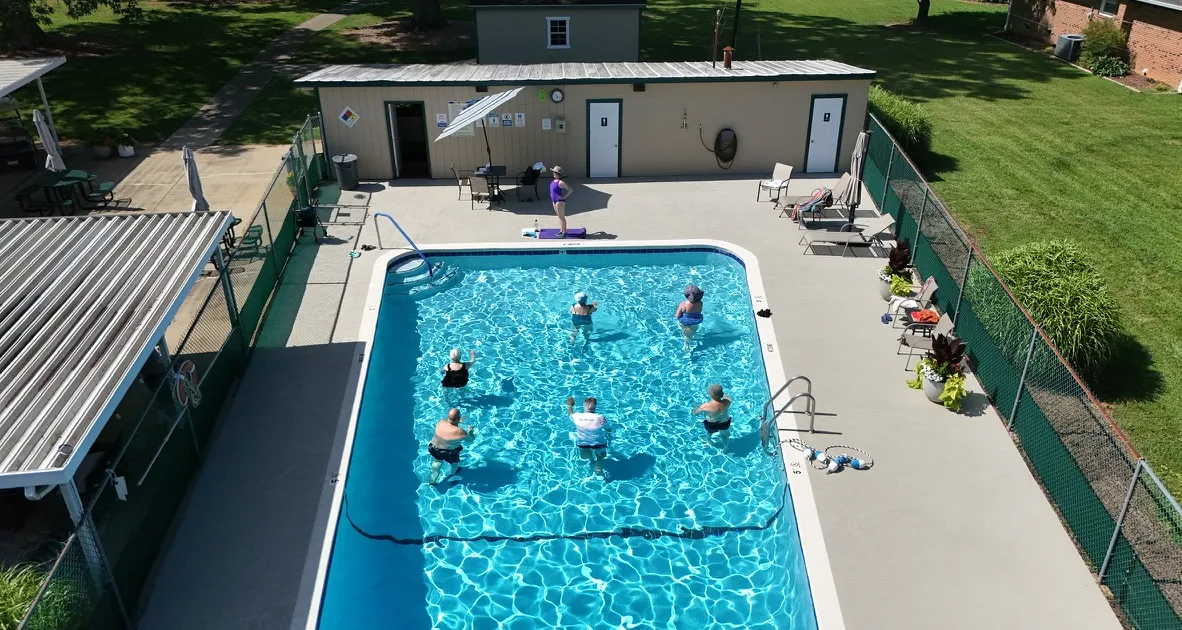 Neighbors taking part in water aerobics