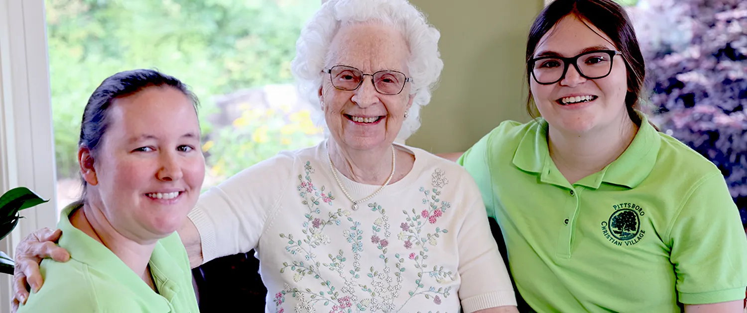 A Care Home resident sharing time with a staff member